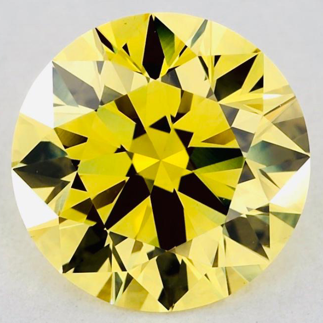 A 1.73 CARAT FANCY INTENSE YELLOW DIAMOND The round brilliant-cut diamond accompanied by a GIA