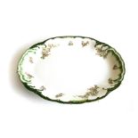 A RIDGEWAYS ENGLAND 'HYDE' PATTERN PLATTER With white flower sprays and foliage, wavy rim in gold