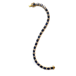 A SAPPHIRE AND DIAMOND BRACELET designed as an articulated line, claw set with twenty-five oval