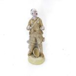 A GENTLEMAN IN KHAKI FIGURINE Bisque figure, lacking rifle, 15 cm