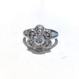 A DIAMOND RING claw set to the centre with a round brilliant cut diamond weighing approximately 0,65