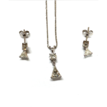 A PAIR OF DIAMOND EARRINGS AND MATCHING PENDANT each claw set with a brilliant-cut diamond