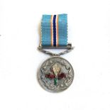 A MINIATURE PRO MERITO MEDAL Complete with ribbon