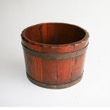 A COPPER BOUND WOODEN BUCKET 22cm high, 32cm diameter