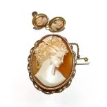 A SUITE OF CAMEO JEWELLERY comprising: a broach 4.5cm in length and a pair of clip on earrings