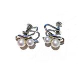 A PAIR OF PEARL EARRINGS four round freshwater cultured pearls, set to the sides in a pair of
