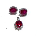 A SUITE OF RUBY AND DIAMOND JEWELLERY including a pendant claw set to the centre with an oval