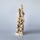 A JAPANESE IVORY OKIMONO OF A SAGE AND KANNON, TAISHŌ PERIOD, 1912 – 1926 NOT SUITABLE FOR EXPORT