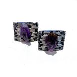 A PAIR OF SILVER CUFFLINKS rectangular with rough engraved surface, with uncut amethysts