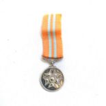 A MINIATRE PRO VIRTUTE MEDAL Silver marked, complete with ribbon