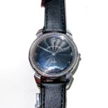 A LADY'S CUREVOY SOBRINOS WRISTWATCH Reference no 43923, the 25mm circular black dial with stainless