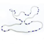 A STRAND OF CULTURED SEED PEARLS 60cm in length, with 9ct gold spacers and lapis lazuli beads at