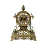 A BRASS CLOCK The circular 10cm dial with Roman numeral hour markers, calibrated outer ring, with