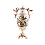 A CAPIDOMONTE TWIN-HANDLED VASE 20TH CENTURY The Twin-handled urn shaped, relief moulded with