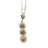 A DIAMOND PENDANT Designed as an articulated line of three fancy-yellow round brilliant-cut diamonds
