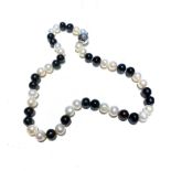A STRAND OF FRESH WATER CULTURED SEED PEARLS white and black combination, 40cm in length, sterling