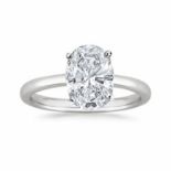 A DIAMOND SOLITAIRE RING Claw set to the centre with an oval-cut diamond weighing 1.39ct, in