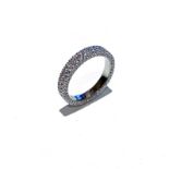 A DIAMOND RING pave set on the top and sides with round brilliant cut diamonds weighing