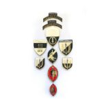 A SET OF ANGOLAN SPECIAL FORCES BADGES Comprising: shoulder flashes, breast badges and bert