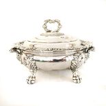 AN ELECTROPLATE SAUCE TUREEN Oval, the stepped cover with gadrooned handle, wavy rim, raised on four