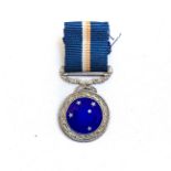 A MINIATURE SOUTHERN CROSS MEDAL Hallmarked, complete with ribbon, SA Coat of Arms