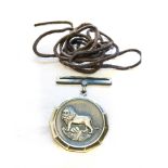 AN SWA LION MEDAL FOR EXCEPTIONAL SERVICE Unnumbered, complete with detachable suspender and leather