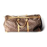 A LOUIS VUITTON TOTE BAG Monogram canvas in brown and gold print, handles in brown and tan print, in