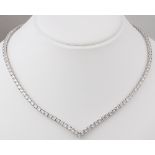 A DIAMOND LINE NECKLACE Designed as a line of one hundred and thirty-nine round brilliant-cut