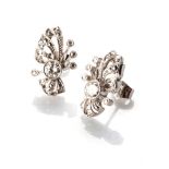 A PAIR OF DIAMOND EARRINGS Bezel-set to the centre with round brilliant-cut diamonds, with a