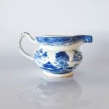 A CHINESE BLUE AND WHITE JUG, QING DYNASTY, 18TH CENTURY The compressed globular body rising from