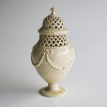 A CERAMIC POT POURI URN With pierced lid, top rim with egg and dart, body decorated with floral