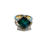AN EMERALD RING claw set to the centre with a princess cut emerald weighing approximately 5 carats