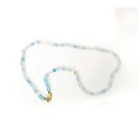 A STRAND OF FACETED TURQUOISE BEADS 44cm in length, each bead approximately 4mm, with 9ct gold clasp