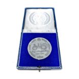 A 1966 MEDAL The sterling silver 1 ounce commemorative medal, accompanied by an original blue velvet