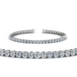 A DIAMOND TENNIS BRACELET Claw set with fifty-one round brilliant-cut diamonds weighing