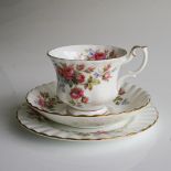 A ROYAL ALBERT 'MOSS ROSE' PATTERN TEA SERVICE Consisting: 6 cups, 6 saucers, 6 cake plates, in