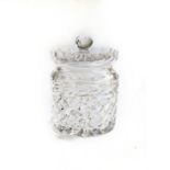 A CUT-GLASS CANDY JAR With a clear cut glass body and cover with a ball finial and star base, 18cm