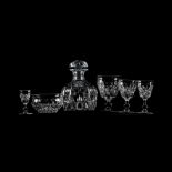A SUITE OF CUT GLASS Comprising: 6 red wine, 6 white wine, 6 sherry,6 port and a decanter with lid(