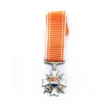 A MINIATURE HONORIS CRUX DECORATION Complete with ribbon; COA on reverse