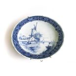A ROYAL SPHINX DELFT PLATE Depicting a windmill, factory mark on underside, P Ragout, Maastricht,