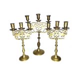 A SET OF THREE BRASS LION OF JUDEA CANDLE HOLDERS, 20TH CENTURY Each with three candle sconces above
