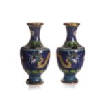 A PAIR OF CHINESE 'CLOISONNE' VASES Depicting dragons and seasonal flowers, each 32cm high