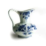 A DELFT WATER PITCHER White with blue floaral design, signed Delft Holland 17B, 7cm high