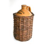 A BEER POT AND WICKER BASKET Stamped, N Rosenfeld & Co. Johannesburg, 48cm