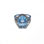 A TOPAZ RING claw set to the centre with an oval brilliant cut Topaz weighing approximately 3,00