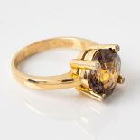 A SMOKY TOPAZ AND DIAMOND RING