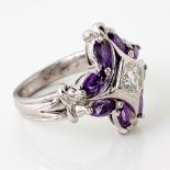 A DIAMOND AND AMETHYST RING