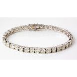 A DIAMOND TENNIS BRACELET