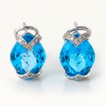 A PAIR OF DIAMOND AND BLUE TOPAZ EARRINGS
