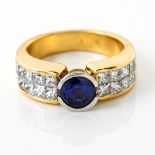 A SAPPHIRE AND DIAMOND RING